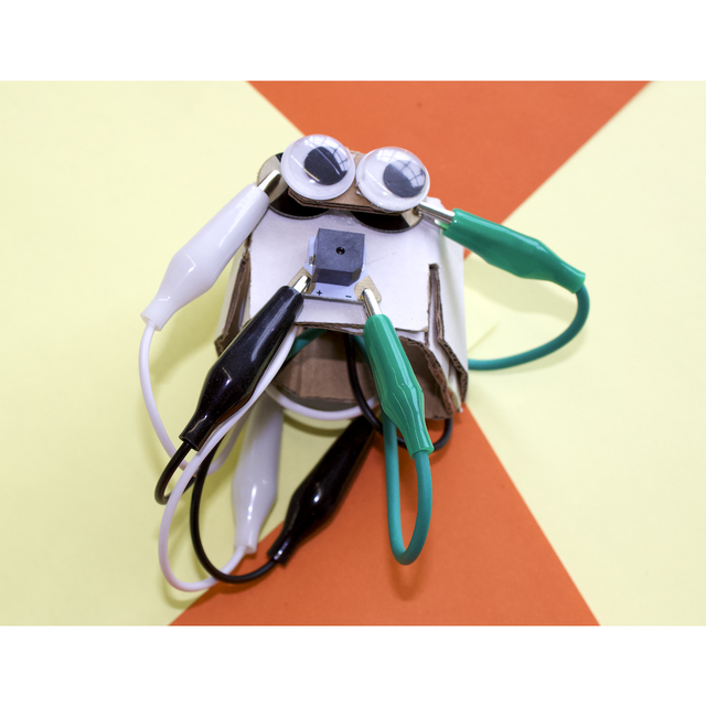 Sparking Sense white cardboard creature with googley eyes and alligator clips